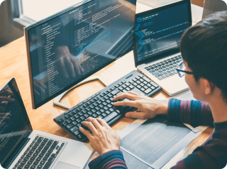 a man with glasses developing a website